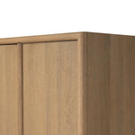 Crafted from sandy solid oak in a waterfall silhouette, this armoire adds a touch of contemporary simplicity to your bedroom. Double doors open to spacious shelving, complemented by a bottom drawer for extra storage. The piece’s bullnose edge and oval iron hardware add variety. Amethyst Home provides interior design, new home construction design consulting, vintage area rugs, and lighting in the Laguna Beach metro area.