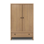Crafted from sandy solid oak in a waterfall silhouette, this armoire adds a touch of contemporary simplicity to your bedroom. Double doors open to spacious shelving, complemented by a bottom drawer for extra storage. The piece’s bullnose edge and oval iron hardware add variety. Amethyst Home provides interior design, new home construction design consulting, vintage area rugs, and lighting in the Monterey metro area.