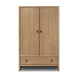 Crafted from sandy solid oak in a waterfall silhouette, this armoire adds a touch of contemporary simplicity to your bedroom. Double doors open to spacious shelving, complemented by a bottom drawer for extra storage. The piece’s bullnose edge and oval iron hardware add variety. Amethyst Home provides interior design, new home construction design consulting, vintage area rugs, and lighting in the Monterey metro area.