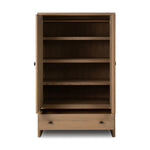 Crafted from sandy solid oak in a waterfall silhouette, this armoire adds a touch of contemporary simplicity to your bedroom. Double doors open to spacious shelving, complemented by a bottom drawer for extra storage. The piece’s bullnose edge and oval iron hardware add variety. Amethyst Home provides interior design, new home construction design consulting, vintage area rugs, and lighting in the Nashville metro area.