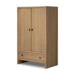 Crafted from sandy solid oak in a waterfall silhouette, this armoire adds a touch of contemporary simplicity to your bedroom. Double doors open to spacious shelving, complemented by a bottom drawer for extra storage. The piece’s bullnose edge and oval iron hardware add variety. Amethyst Home provides interior design, new home construction design consulting, vintage area rugs, and lighting in the Scottsdale metro area.