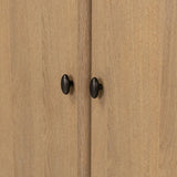 Crafted from sandy solid oak in a waterfall silhouette, this armoire adds a touch of contemporary simplicity to your bedroom. Double doors open to spacious shelving, complemented by a bottom drawer for extra storage. The piece’s bullnose edge and oval iron hardware add variety. Amethyst Home provides interior design, new home construction design consulting, vintage area rugs, and lighting in the Seattle metro area.