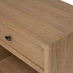 Crafted from sandy solid oak in a waterfall silhouette, this nightstand adds a touch of contemporary simplicity to the bedside. Stack your favorite books on a spacious bottom shelf. The piece’s bullnose edge and oval iron drawer pull add variety. Amethyst Home provides interior design, new home construction design consulting, vintage area rugs, and lighting in the Miami metro area.