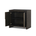 Espresso-finished oak casing pairs with two coffee-colored iron door fronts, for an intriguing material mix. With bullnose waterfall framing and offset metal hardware, this compact cabinet offers an elevated industrial look to your living space. Slighter scale perfect for smaller spaces. Amethyst Home provides interior design, new home construction design consulting, vintage area rugs, and lighting in the Los Angeles metro area.