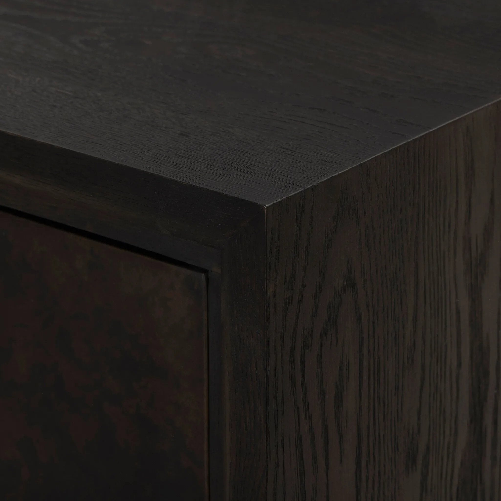 Espresso-finished oak casing pairs with two coffee-colored iron door fronts, for an intriguing material mix. With bullnose waterfall framing and offset metal hardware, this compact cabinet offers an elevated industrial look to your living space. Slighter scale perfect for smaller spaces. Amethyst Home provides interior design, new home construction design consulting, vintage area rugs, and lighting in the Park City metro area.