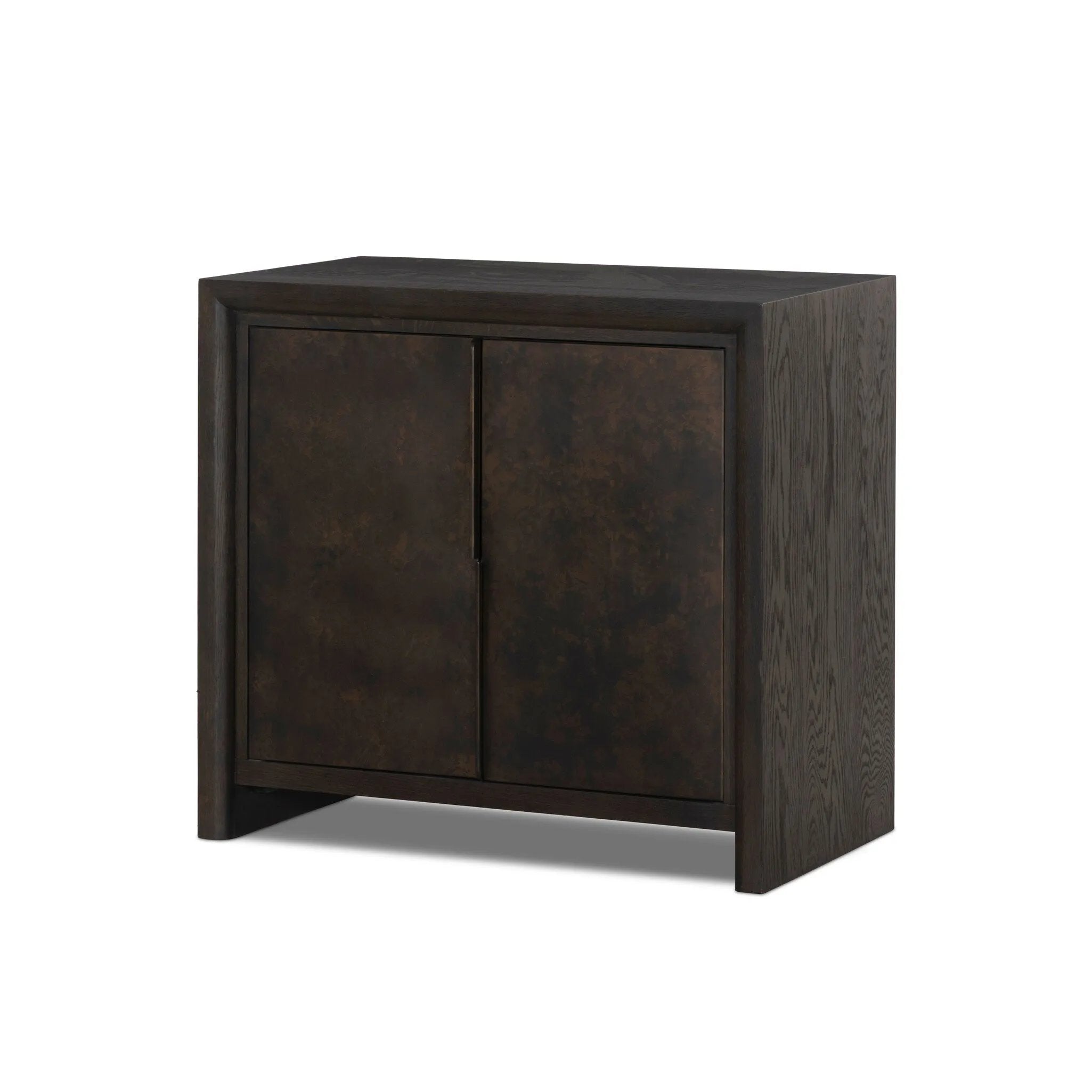 Espresso-finished oak casing pairs with two coffee-colored iron door fronts, for an intriguing material mix. With bullnose waterfall framing and offset metal hardware, this compact cabinet offers an elevated industrial look to your living space. Slighter scale perfect for smaller spaces. Amethyst Home provides interior design, new home construction design consulting, vintage area rugs, and lighting in the Washington metro area.