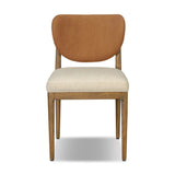 Midcentury meets organic modernism in this mixed-material dining chair. A top-grain leather seat back pairs with a cushioned seat upholstered in performance fabric, with stitch detailing along the seat back. All framed by solid oak finished in a warm amber. Amethyst Home provides interior design, new home construction design consulting, vintage area rugs, and lighting in the Portland metro area.