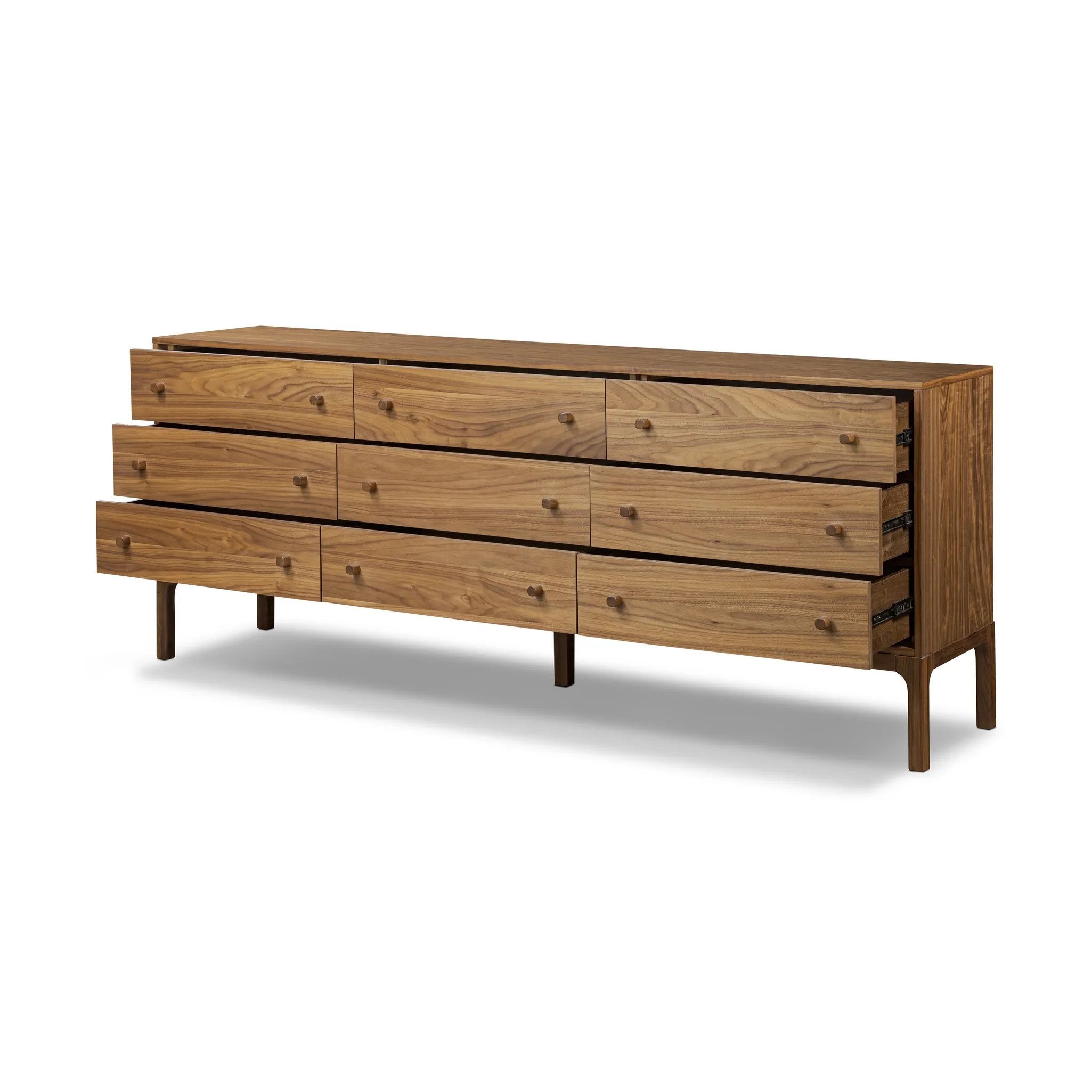 Featuring Arturo Natural Walnut Veneer 9 Drawer Dresser by Four Hands at Amethyst Home. Inspired by campaign-style furniture of the 1800s — packable pieces first designed for traveling military use — a simply shaped dresser of natural walnut features a subtly inset top and rounded legs, finished with wooden hardware. This item has been modified to comply wit. Amethyst Home provides interior design, new home construction design consulting, vintage area rugs, and lighting in the Portland metro area.