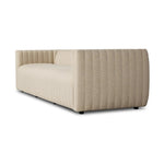 A dramatically channeled outdoor sofa with subtly textured upholstery for a clean, inviting look. Cover or store indoors during inclement weather and when not in use Amethyst Home provides interior design, new home construction design consulting, vintage area rugs, and lighting in the Houston metro area.