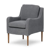 Heritage-inspired comfort. Sloping track arms are a study in playful forms, while the frame's fluid shape creates a simple, polished look. Tapered legs extend beyond a short skirt for a more relaxed style. Covered in 100% linen. A design collaboration by Amber Lewis and Four Hands. Amethyst Home provides interior design, new home construction design consulting, vintage area rugs, and lighting in the Park City metro area.