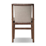 Midcentury-inspired with its minimalist wooden frame, this armless dining chair features a low back and float-like upholstered seat Amethyst Home provides interior design, new home construction design consulting, vintage area rugs, and lighting in the Austin metro area.