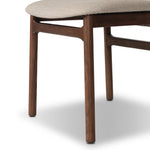 Midcentury-inspired with its minimalist wooden frame, this armless dining chair features a low back and float-like upholstered seat Amethyst Home provides interior design, new home construction design consulting, vintage area rugs, and lighting in the Houston metro area.