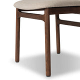 Midcentury-inspired with its minimalist wooden frame, this armless dining chair features a low back and float-like upholstered seat Amethyst Home provides interior design, new home construction design consulting, vintage area rugs, and lighting in the Houston metro area.