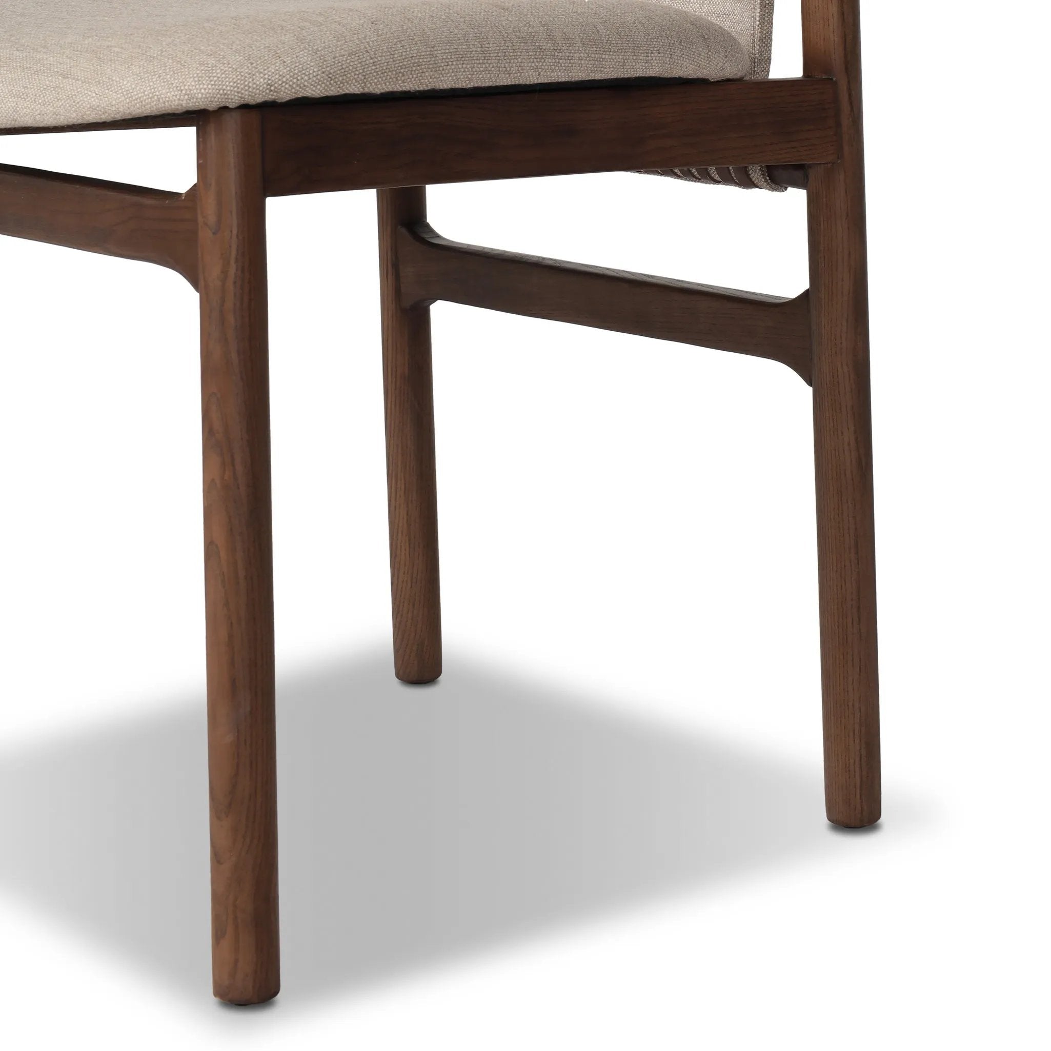 Midcentury-inspired with its minimalist wooden frame, this armless dining chair features a low back and float-like upholstered seat Amethyst Home provides interior design, new home construction design consulting, vintage area rugs, and lighting in the Omaha metro area.