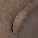 A 360 swivel chair fully upholstered in an inviting neutral coffee color, with a beautifully curved silhouette and arch-style cutout where the seat meets the back, creating a lightened sense of softness.As lovers of clean style at Amethyst, we love the nature inspired Barclay Swivel Chair - Laughlin Cafe. Amethyst Home provides interior design, new home construction design consulting, vintage area rugs, and lighting in the Park City metro area.
