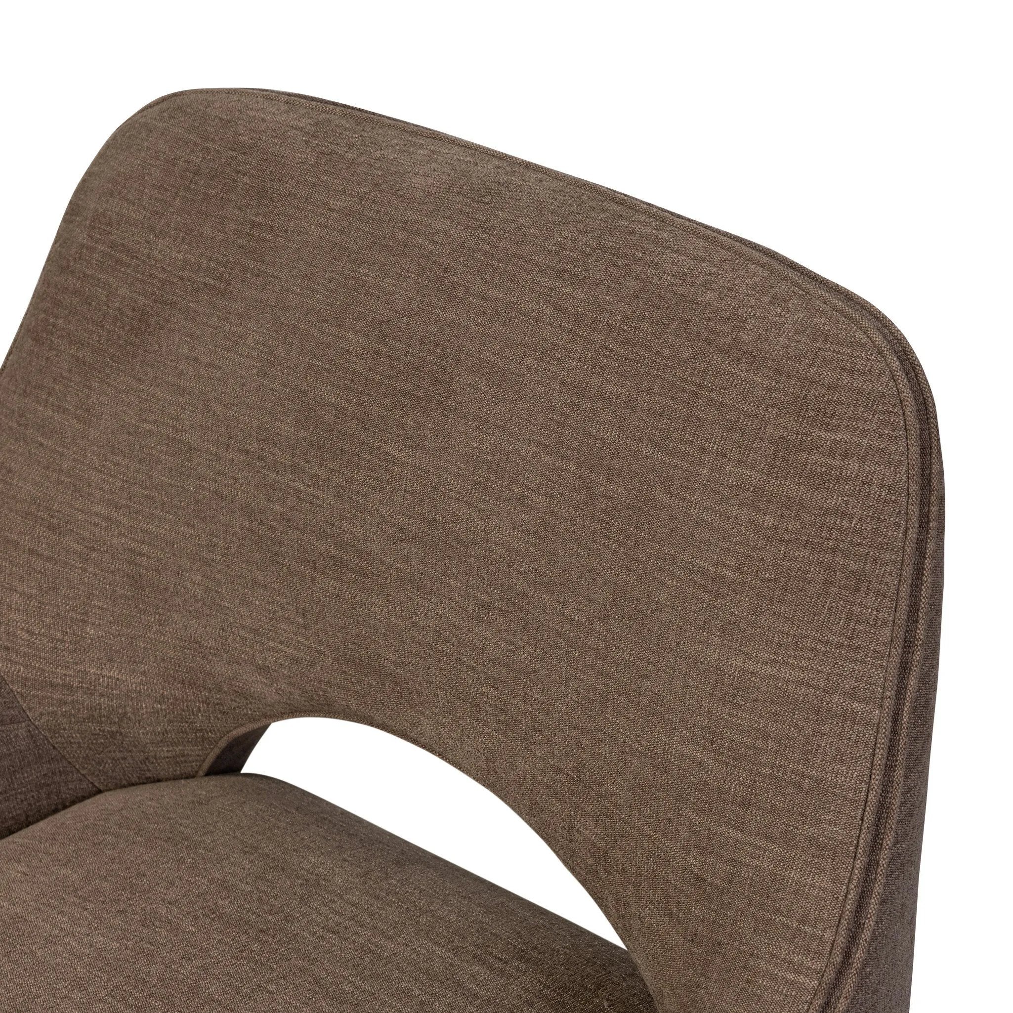 A 360 swivel chair fully upholstered in an inviting neutral coffee color, with a beautifully curved silhouette and arch-style cutout where the seat meets the back, creating a lightened sense of softness.As lovers of clean style at Amethyst, we love the nature inspired Barclay Swivel Chair - Laughlin Cafe. Amethyst Home provides interior design, new home construction design consulting, vintage area rugs, and lighting in the Salt Lake City metro area.