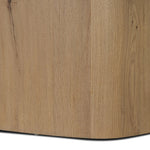 A stately dining style inspired by soft Brutalism. Crafted from aged smoked oak, a pair of matching pedestal bases features a delicate break between them, bringing a touch of lightness to such a substantial piece. A wide rectangular tabletop shapes arched sides that flow into rounded corners, finished off with bullnose edging Amethyst Home provides interior design, new home construction design consulting, vintage area rugs, and lighting in the Calabasas metro area.