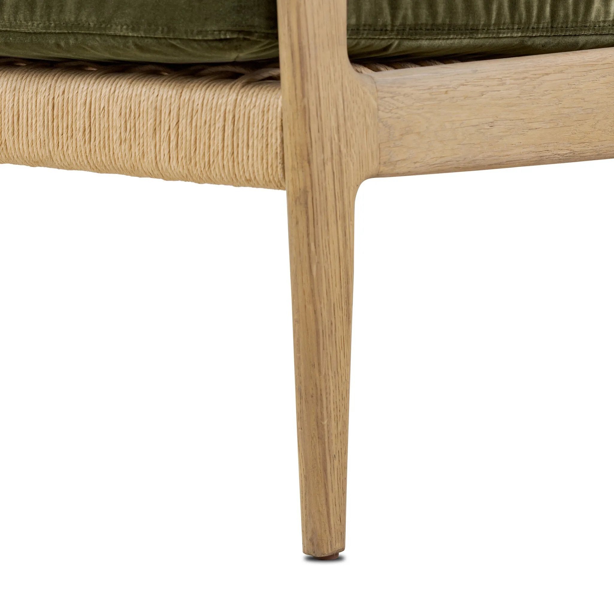 Tapered legs and sloped paddle arms frame the visible joinery and handwoven rope details of this accent chair, for a monochromatic yet visually intriguing frame. Finished with loose, velvet-upholstered seat and back cushions in a rich olive hue — for a subtle color contrast that celebrates the natural beauty of each material Amethyst Home provides interior design, new home construction design consulting, vintage area rugs, and lighting in the Tampa metro area.