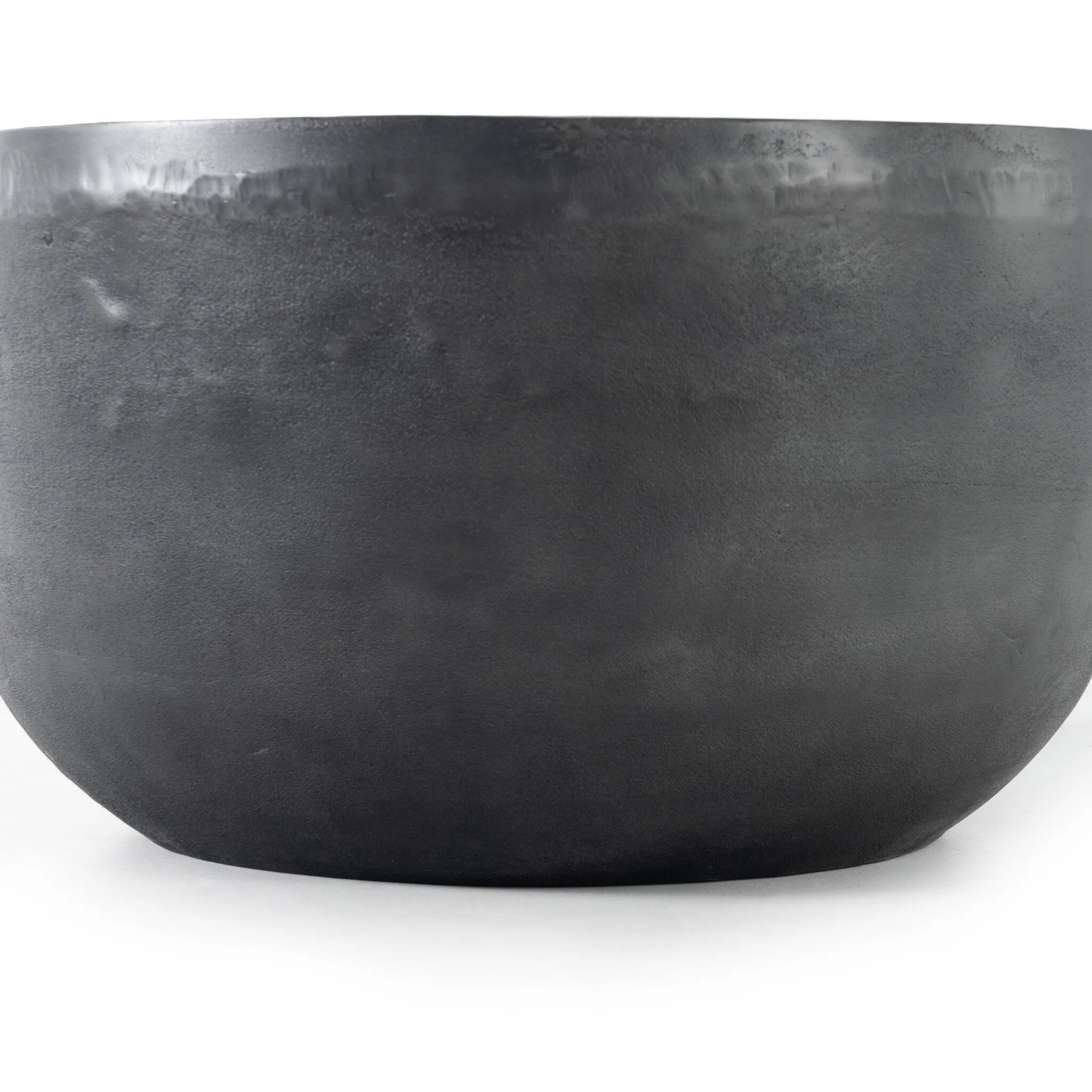 An aged grey finish highlights aluminum's natural depth, for a sleek, simple look with implied movement. Stylish indoors or out. Cover or store indoors during inclement weather and when not in use.As lovers of wabi sabi style at Amethyst, we love the warm modern inspired Basil Outdoor End Table - Aged Grey. Amethyst Home provides interior design, new home construction design consulting, vintage area rugs, and lighting in the Charlotte metro area.