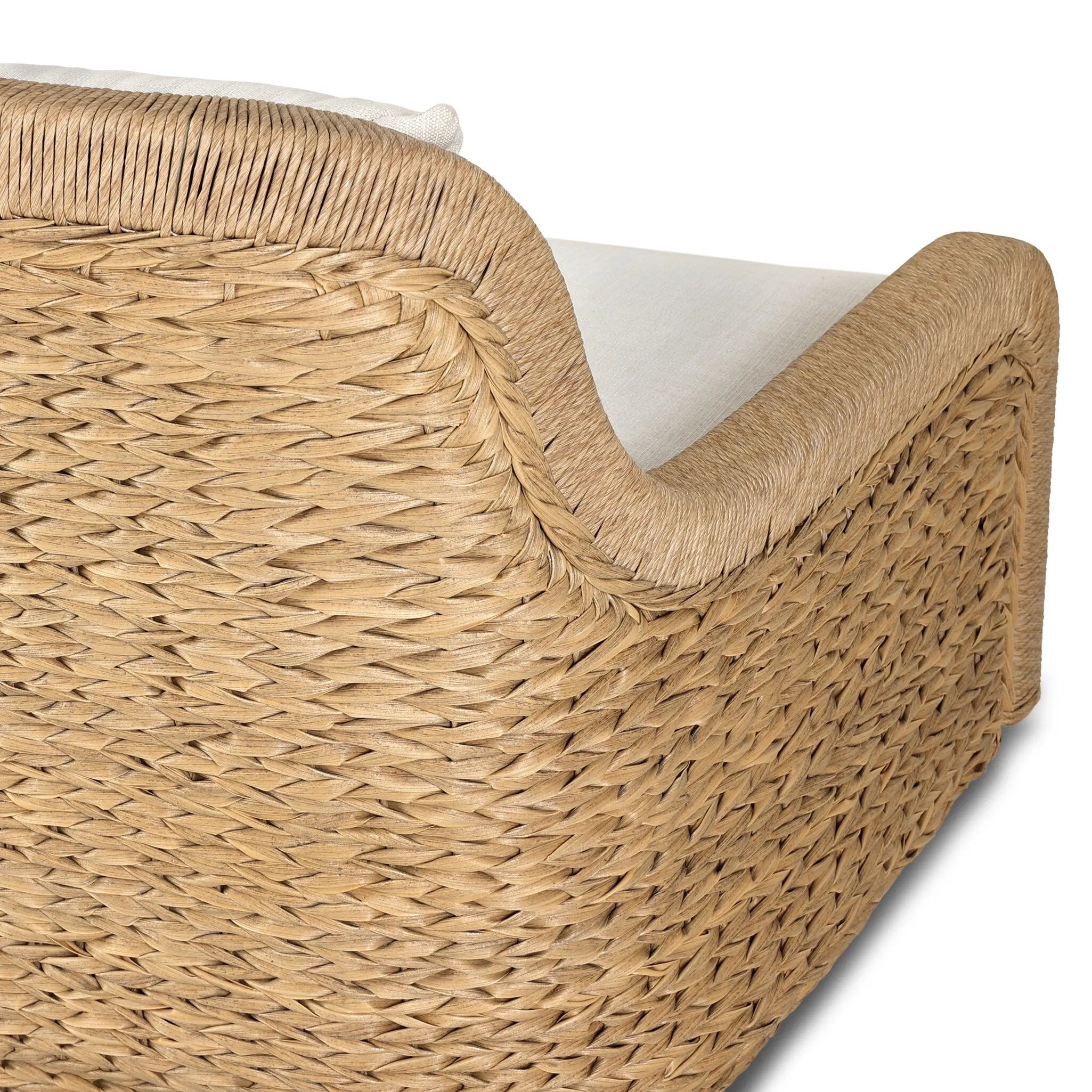 For a casual, coastal vibe, this outdoor chair takes on the classic slipper silhouette with added dimension and movement atop a 360-swivel base. It's all about the heavy braided weave technique: Faux banana leaf comes together in a mix of weave formats for added visual interest, finishing with a cord wrap detail on the arms. Amethyst Home provides interior design, new home construction design consulting, vintage area rugs, and lighting in the Park City metro area.