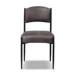 Bring a refreshed midcentury look to your table. Comfortable seat and back cushions are upholstered in a black top-grain leather, with a slim iron frame curving at the top to soften things up. Simple tapered legs complete the look.As enthusiasts of natural aesthetics at Amethyst, we love the nature inspired Bellaire Dining Chair - Palermo Black. Amethyst Home provides interior design, new home construction design consulting, vintage area rugs, and lighting in the Laguna Beach metro area.