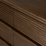 Inspired by aerodynamic-inspired Streamline Moderne style, stacked scalloped reeding wraps this spiced oak dresser with six spacious drawers. The result: a beautifully rhythmic, repeated look. With integrated hardware for a clean finish.As fans of natural materials at Amethyst, we love the nature inspired Benny 6 Drawer Dresser - Spiced Oak Veneer. Amethyst Home provides interior design, new home construction design consulting, vintage area rugs, and lighting in the San Diego metro area.
