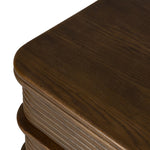 Inspired by aerodynamic-inspired Streamline Moderne style, stacked scalloped reeding wraps this spiced oak nightstand. The result: a beautifully rhythmic, repeated look. With integrated hardware for a clean finish.As lovers of modern aesthetics at Amethyst, we love the warm modern inspired Benny Nightstand - Spiced Oak Veneer. Amethyst Home provides interior design, new home construction design consulting, vintage area rugs, and lighting in the Laguna Beach metro area.