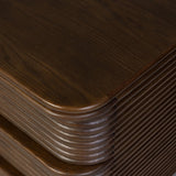Inspired by aerodynamic-inspired Streamline Moderne style, stacked scalloped reeding wraps this spiced oak nightstand. The result: a beautifully rhythmic, repeated look. With integrated hardware for a clean finish.As lovers of modern aesthetics at Amethyst, we love the warm modern inspired Benny Nightstand - Spiced Oak Veneer. Amethyst Home provides interior design, new home construction design consulting, vintage area rugs, and lighting in the Seattle metro area.