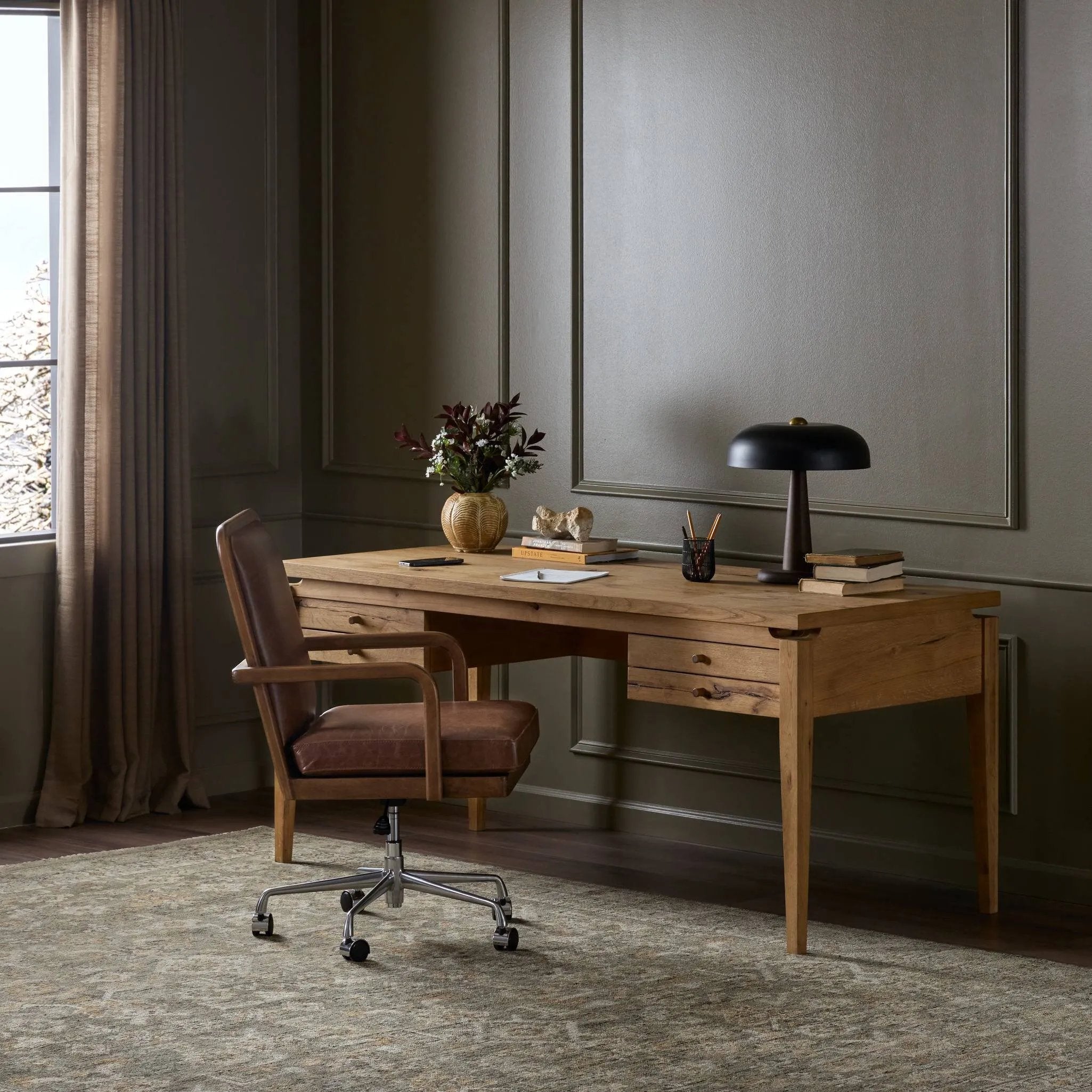 Warm up your workspace with this light-finished writing desk of rich character oak. Tapered legs and subtle corner relief details create a simplified look that complements a home office or flex space. Amethyst Home provides interior design, new home construction design consulting, vintage area rugs, and lighting in the Kansas City metro area.