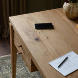 Featuring Bergstrom Warm Natural Oak Veneer Desk by Four Hands at Amethyst Home. Warm up your workspace with this light-finished writing desk of rich character oak. Tapered legs and subtle corner relief details create a simplified look that complements a home office or flex space. Complete with thoughtful touches like built-in cord management, a flip-to. Amethyst Home provides interior design, new home construction design consulting, vintage area rugs, and lighting in the Newport Beach metro area.