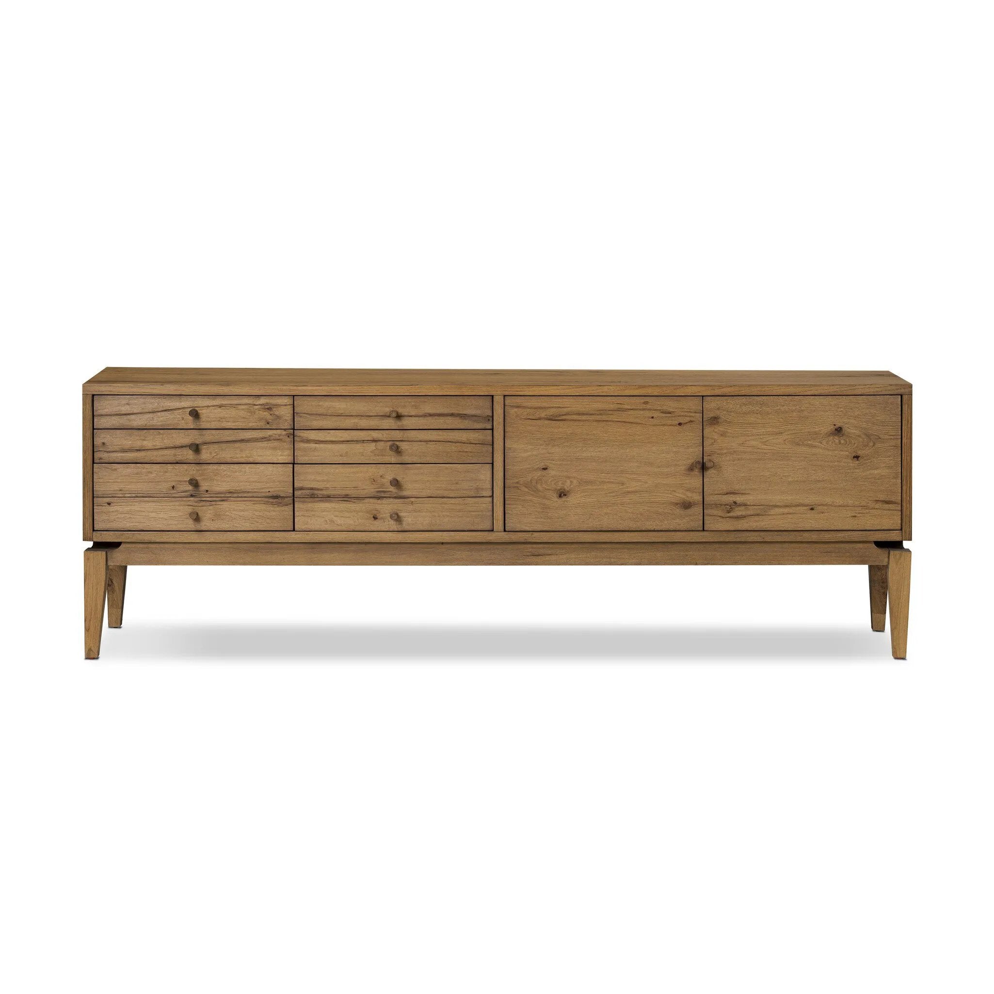Light, natural oak reflects the New American inspiration behind this storage-driven console of warm, natural oak. Elevated on tapered legs with corner relief accents, its asymmetrical design offers storage for your media needs and more Amethyst Home provides interior design, new home construction design consulting, vintage area rugs, and lighting in the Austin metro area.