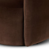 Compact and cozy, this high-back swivel chair with pillow-formed arms features contrast piping outlining its silhouette. Velvety performance fabric in a deep brown hue offers maximum comfort. The base is affixed to a 360-degree swivel for relaxed lounging. Amethyst Home provides interior design, new home construction design consulting, vintage area rugs, and lighting in the Houston metro area.