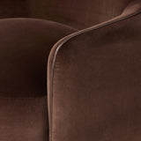Compact and cozy, this high-back swivel chair with pillow-formed arms features contrast piping outlining its silhouette. Velvety performance fabric in a deep brown hue offers maximum comfort. The base is affixed to a 360-degree swivel for relaxed lounging. Amethyst Home provides interior design, new home construction design consulting, vintage area rugs, and lighting in the Salt Lake City metro area.