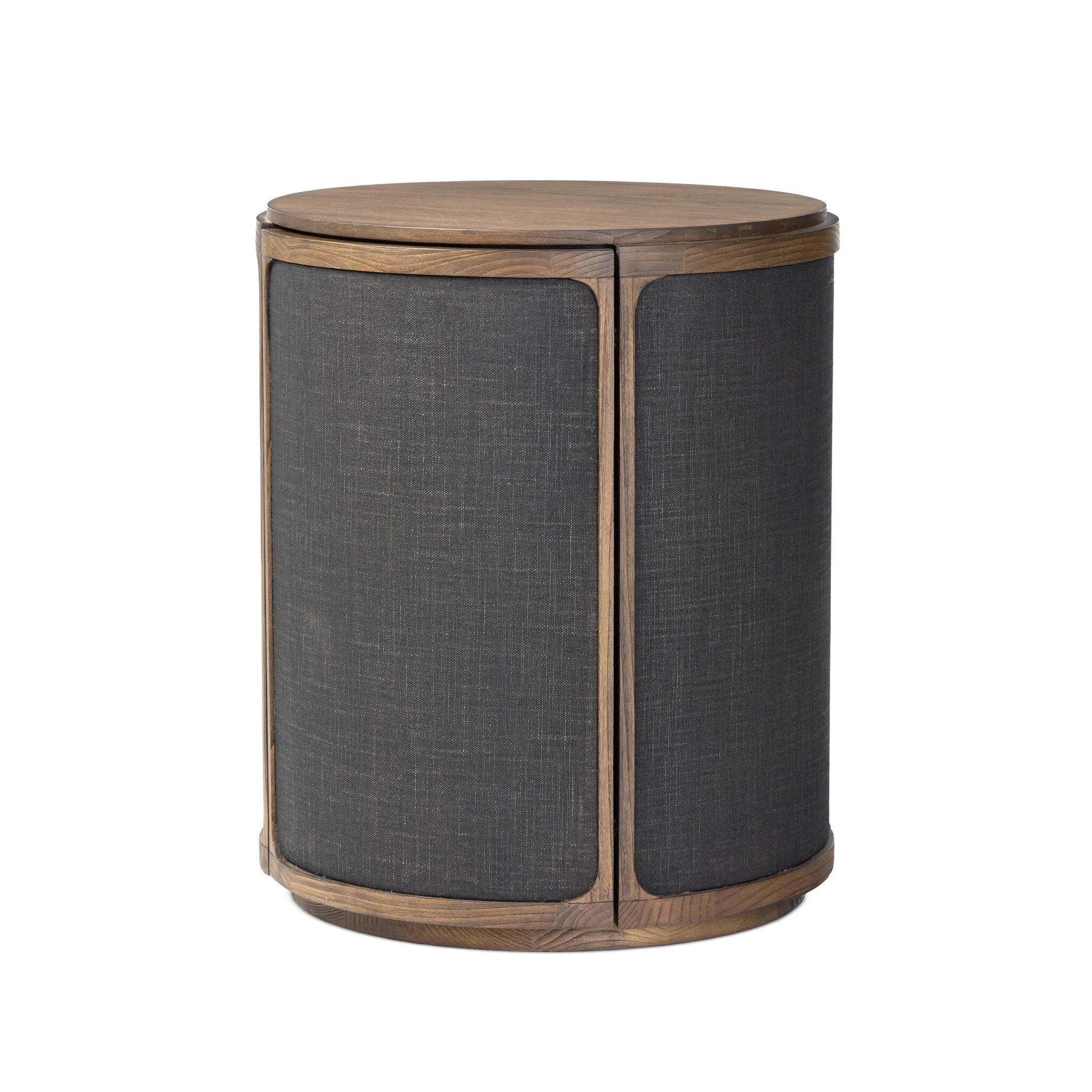 A balance of materials and shape, texture and detail. Warm sungkai wood frames lacquered, black linen side panels. A hidden door opens to interior storage, finishing off this design-forward coffee table with a clever touch.As lovers of wabi sabi materials at Amethyst, we love the designer inspired Bertie End Table. Amethyst Home provides interior design, new home construction design consulting, vintage area rugs, and lighting in the Omaha metro area.