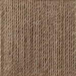 A steel dining chair frame is softened and paired with natural woven fibers. Thin, tapered legs and a tall channeled back cre