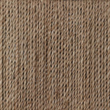 A steel dining chair frame is softened and paired with natural woven fibers. Thin, tapered legs and a tall channeled back cre
