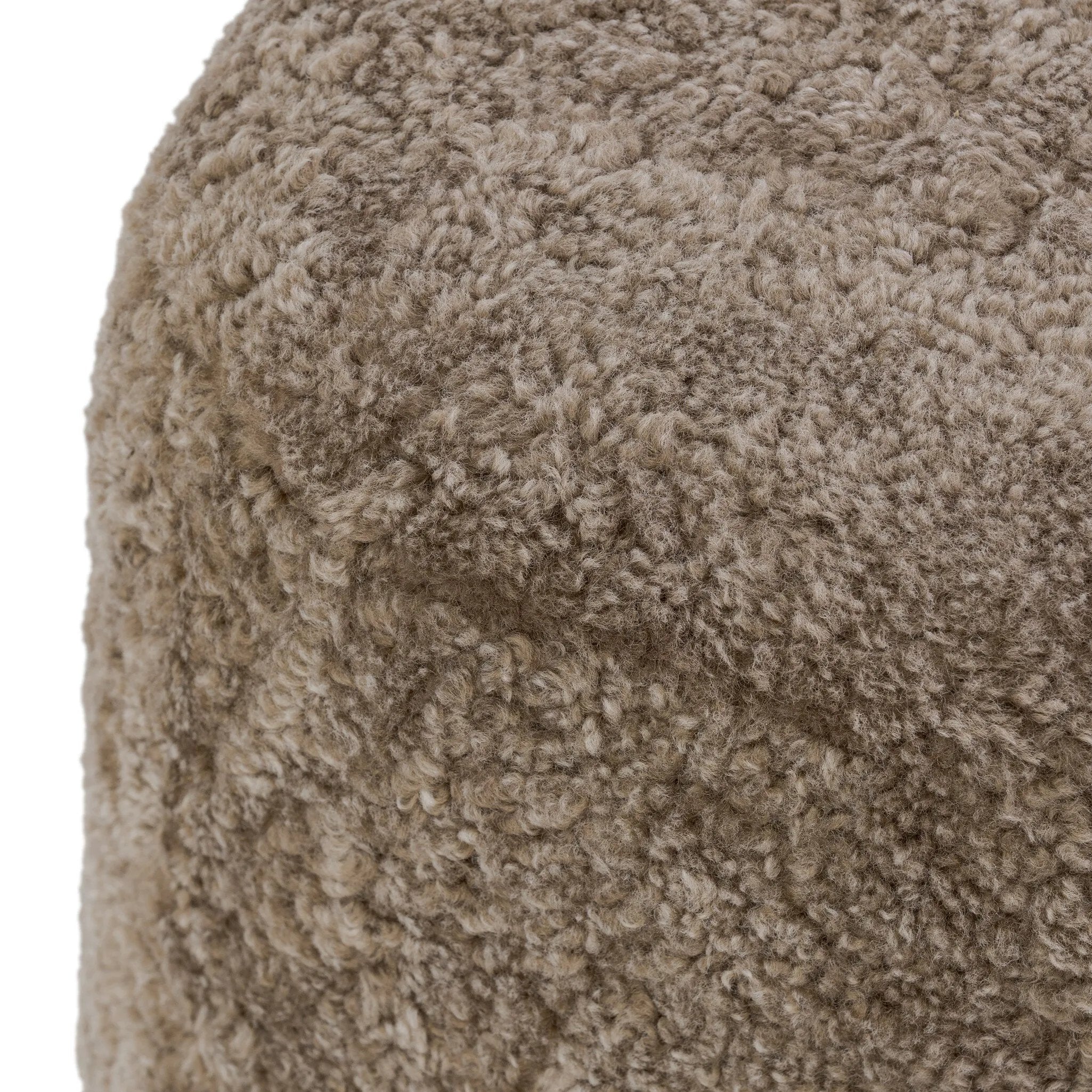 For an extra seat or propped feet, this welcoming ottoman features a subtly tapered shape and a rounded base with bun feet beneath. Crafted from solid oak and upholstered with taupe shearling for extra texture Amethyst Home provides interior design, new home construction design consulting, vintage area rugs, and lighting in the Portland metro area.