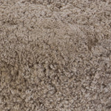 For an extra seat or propped feet, this welcoming ottoman features a subtly tapered shape and a rounded base with bun feet beneath. Crafted from solid oak and upholstered with taupe shearling for extra texture Amethyst Home provides interior design, new home construction design consulting, vintage area rugs, and lighting in the San Diego metro area.