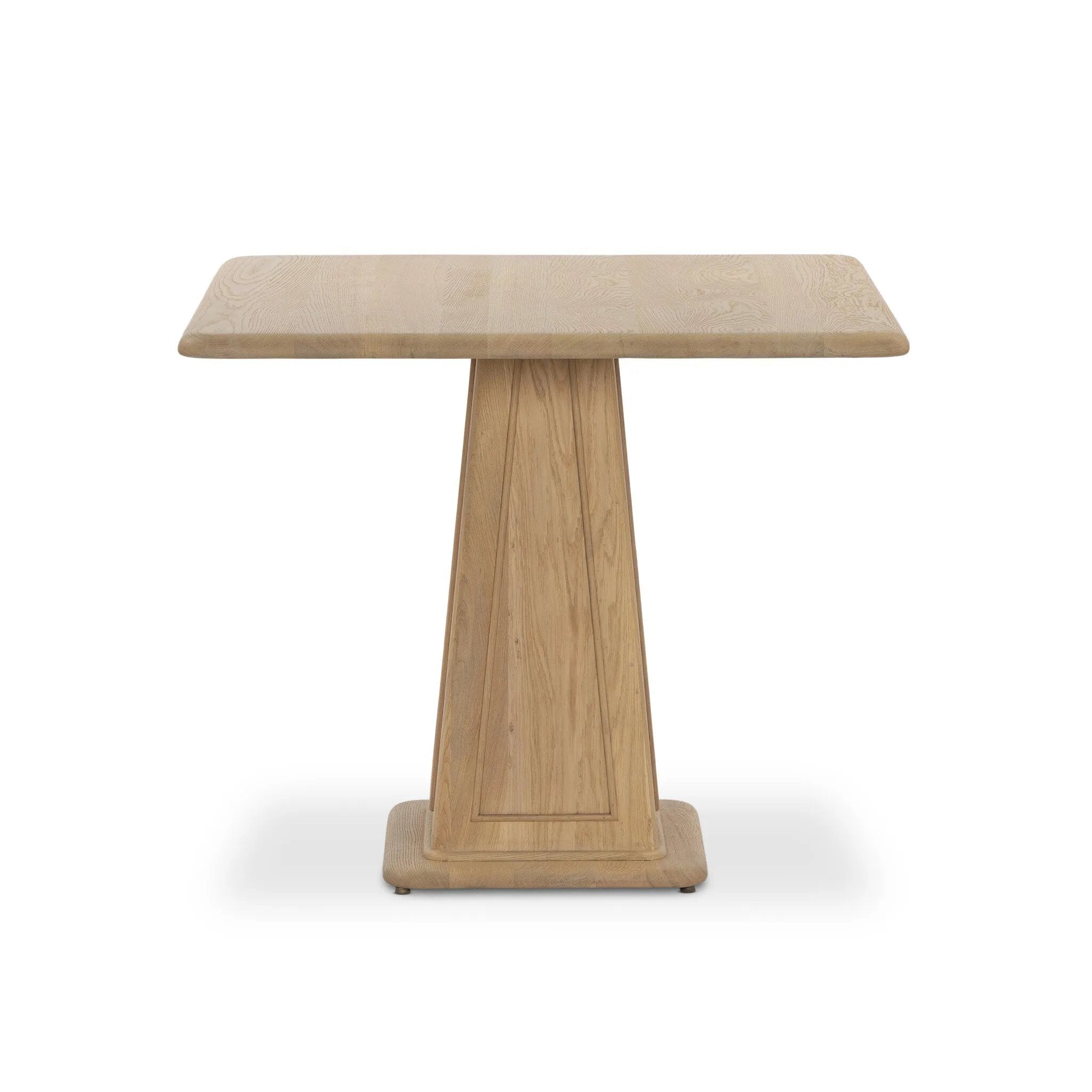 A squared shape and smaller scale makes this bistro-style table perfect for intimate spaces. Made from solid oak with a beautifully light finish, a tapered base and softened bullnose edges reflect a traditional look that works into any space with ease. Amethyst Home provides interior design, new home construction design consulting, vintage area rugs, and lighting in the Boston metro area.