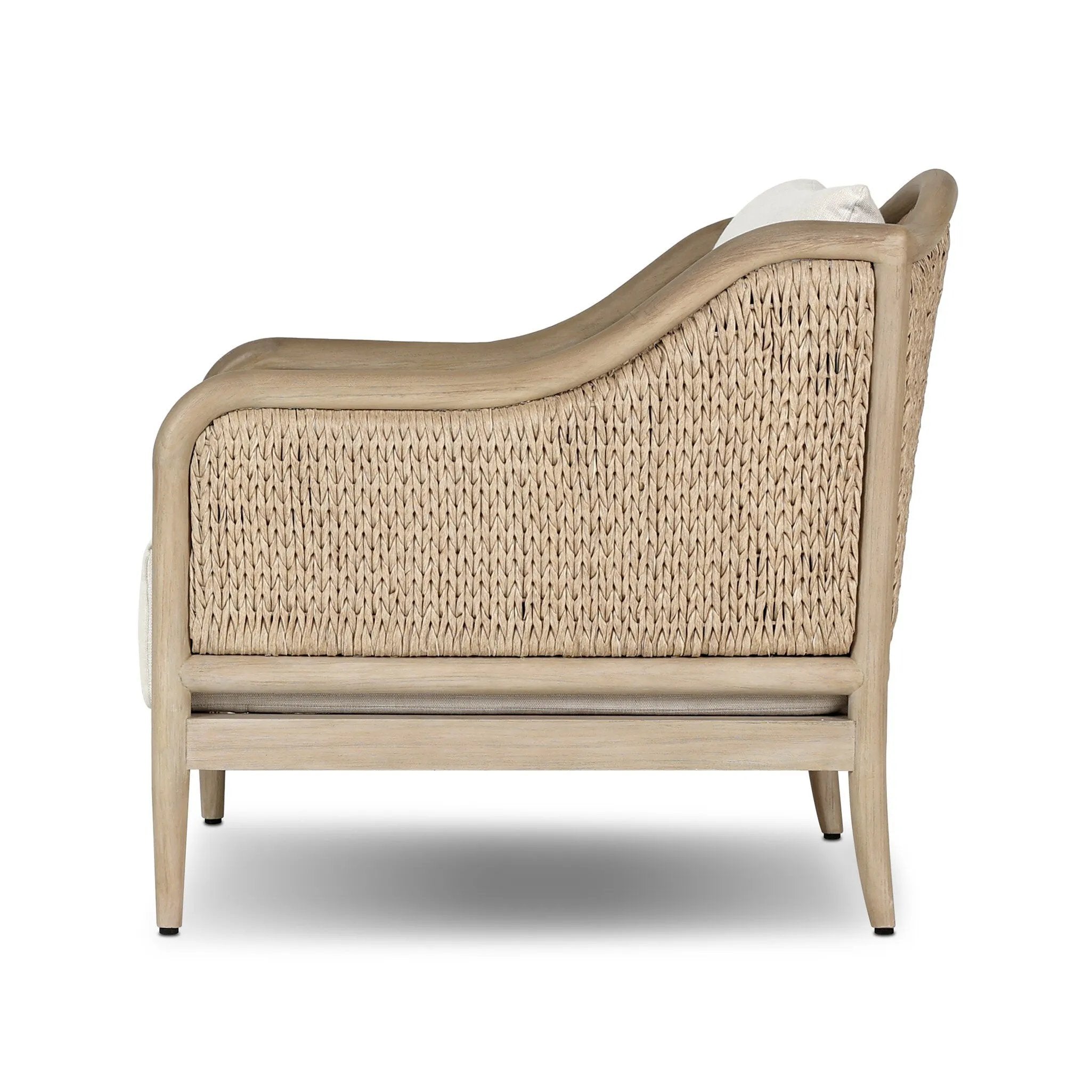 A fresh take on the traditional, this outdoor chair reimagines classic silhouettes with faux banana leaf panels bringing heavy texture to the frame. The camel back and swooping curves add softness, with removable cushions in a linen-like fabric adding comfort. Cover or store inside during inclement weather and when not in use. Amethyst Home provides interior design, new home construction design consulting, vintage area rugs, and lighting in the Calabasas metro area.