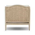 A fresh take on the traditional, this outdoor chair reimagines classic silhouettes with faux banana leaf panels bringing heavy texture to the frame. The camel back and swooping curves add softness, with removable cushions in a linen-like fabric adding comfort. Cover or store inside during inclement weather and when not in use. Amethyst Home provides interior design, new home construction design consulting, vintage area rugs, and lighting in the Charlotte metro area.