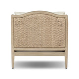 A fresh take on the traditional, this outdoor chair reimagines classic silhouettes with faux banana leaf panels bringing heavy texture to the frame. The camel back and swooping curves add softness, with removable cushions in a linen-like fabric adding comfort. Cover or store inside during inclement weather and when not in use. Amethyst Home provides interior design, new home construction design consulting, vintage area rugs, and lighting in the Charlotte metro area.