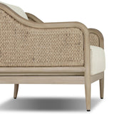 A fresh take on the traditional, this outdoor chair reimagines classic silhouettes with faux banana leaf panels bringing heavy texture to the frame. The camel back and swooping curves add softness, with removable cushions in a linen-like fabric adding comfort. Cover or store inside during inclement weather and when not in use. Amethyst Home provides interior design, new home construction design consulting, vintage area rugs, and lighting in the Omaha metro area.