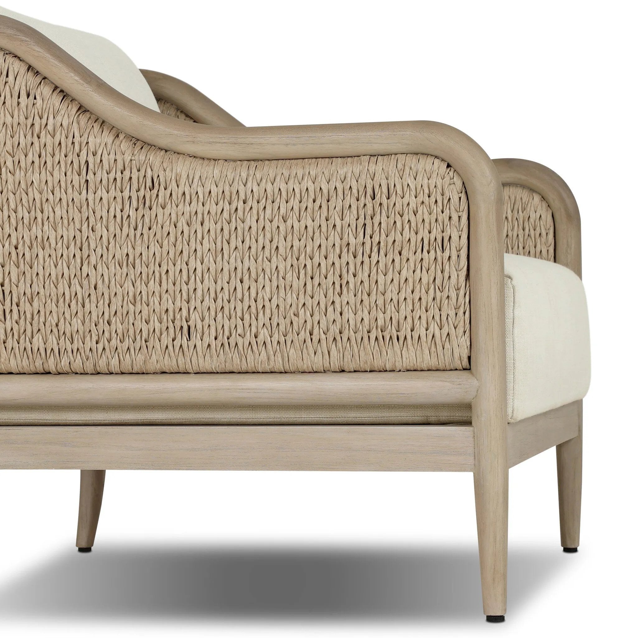 A fresh take on the traditional, this outdoor chair reimagines classic silhouettes with faux banana leaf panels bringing heavy texture to the frame. The camel back and swooping curves add softness, with removable cushions in a linen-like fabric adding comfort. Cover or store inside during inclement weather and when not in use. Amethyst Home provides interior design, new home construction design consulting, vintage area rugs, and lighting in the Omaha metro area.