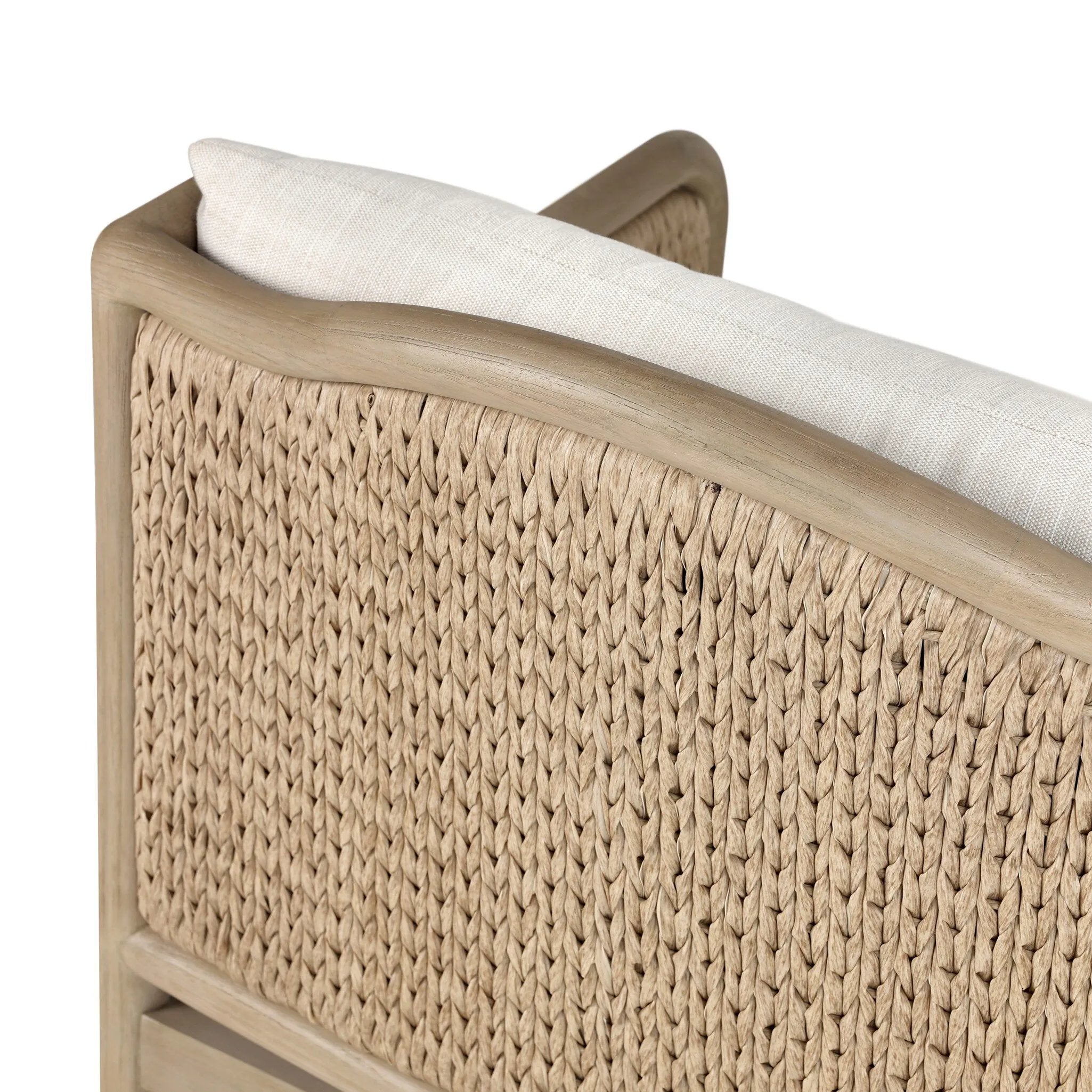 A fresh take on the traditional, this outdoor chair reimagines classic silhouettes with faux banana leaf panels bringing heavy texture to the frame. The camel back and swooping curves add softness, with removable cushions in a linen-like fabric adding comfort. Cover or store inside during inclement weather and when not in use. Amethyst Home provides interior design, new home construction design consulting, vintage area rugs, and lighting in the Portland metro area.