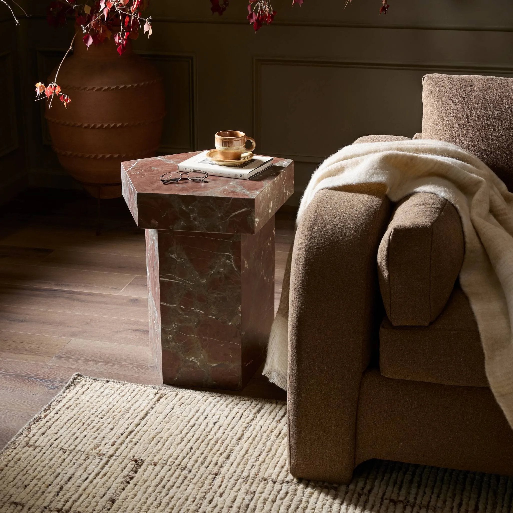Add a unique piece to your collection with a solid marble end table. With an irregular pentagon shape and heavy natural veining in rich rust and grey tones, each piece varies for a look that's truly one of a kind Amethyst Home provides interior design, new home construction design consulting, vintage area rugs, and lighting in the Miami metro area.