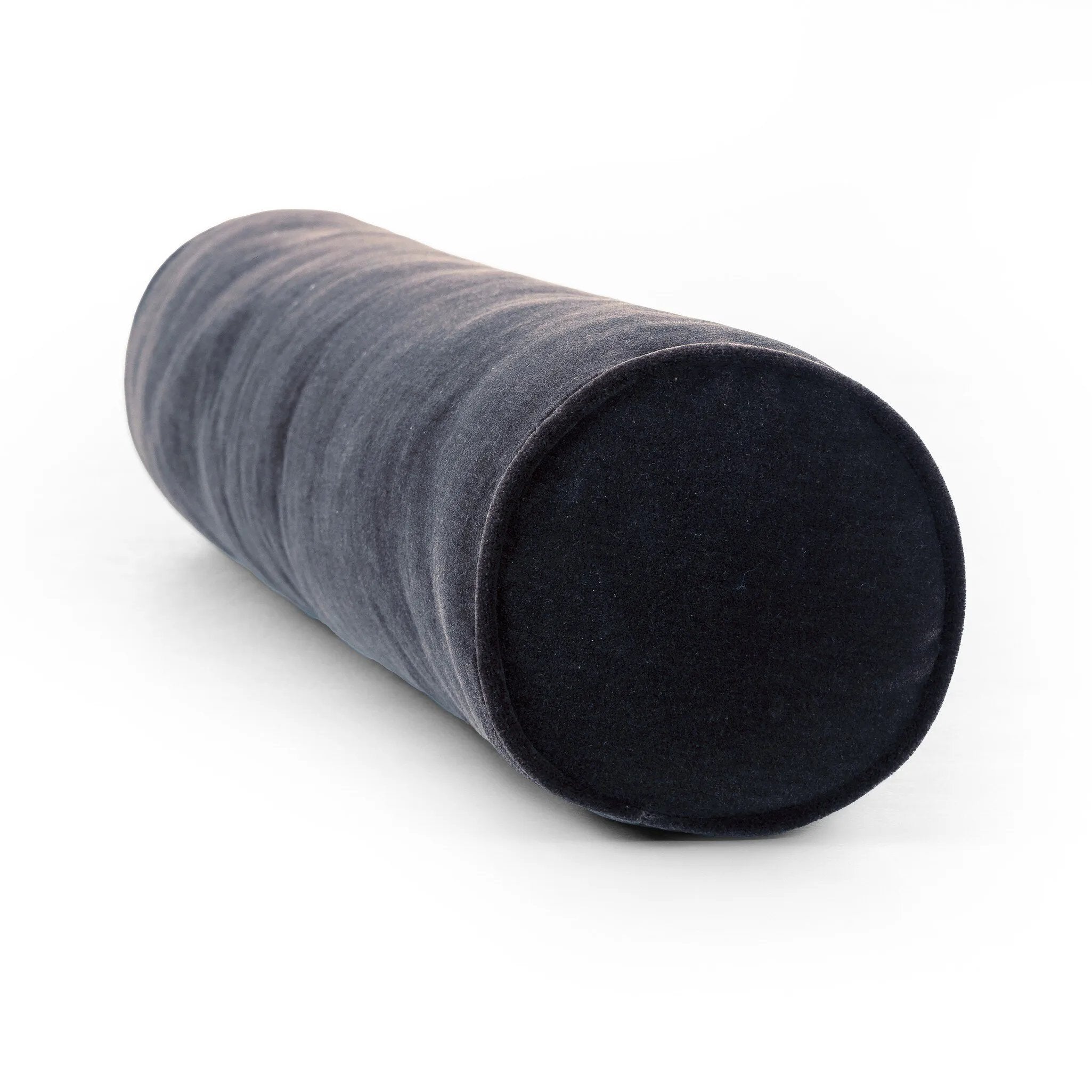 A long, navy-colored bolster pillow elevates beds and sofas in an instant. Crafted from saturated wool velvet, for a sustainable alternative to mohair, with a hidden zipper for a smooth silhouette.As lovers of wabi sabi aesthetics at Amethyst, we love the warm modern inspired Bridger Bolster Pillow - Monte Navy. Amethyst Home provides interior design, new home construction design consulting, vintage area rugs, and lighting in the Salt Lake City metro area.