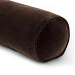 A long, chocolate-colored bolster pillow elevates beds and sofas in an instant. Crafted from saturated wool velvet, for a sustainable alternative to mohair, with a hidden zipper for a smooth silhouette Amethyst Home provides interior design, new home construction design consulting, vintage area rugs, and lighting in the Calabasas metro area.