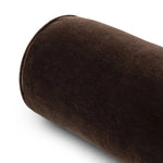 A long, chocolate-colored bolster pillow elevates beds and sofas in an instant. Crafted from saturated wool velvet, for a sustainable alternative to mohair, with a hidden zipper for a smooth silhouette Amethyst Home provides interior design, new home construction design consulting, vintage area rugs, and lighting in the Houston metro area.