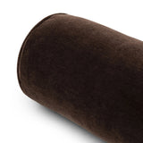 A long, chocolate-colored bolster pillow elevates beds and sofas in an instant. Crafted from saturated wool velvet, for a sustainable alternative to mohair, with a hidden zipper for a smooth silhouette Amethyst Home provides interior design, new home construction design consulting, vintage area rugs, and lighting in the Houston metro area.